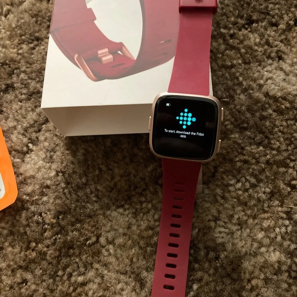 Rose Gold Fitbit Versa with Accessories all in excellent condition